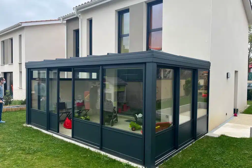 Véranda aluminium maison neuve par l'Atelier de l'Alu