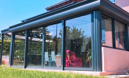 Véranda ouvertures coulissantes maison par l'Atelier de l'Alu